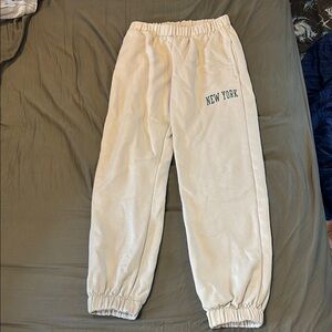 Brandy Melville Cream sweatpants with green New York